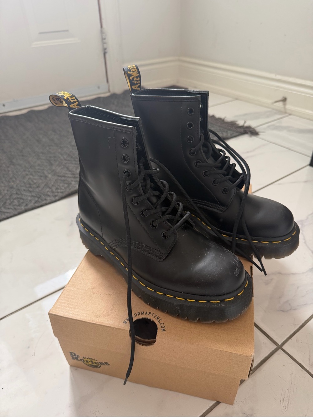 Dr. Martens Black Leather Lace-Up Platform Boots with Yellow Stitching